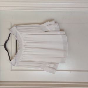 Large, White, off the shoulder top.